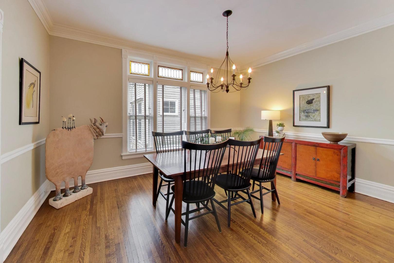 1235 Maple Avenue Evanston, IL 60202 - Photo 18 of 57 a view of a dining room with furniture window and wooden floor