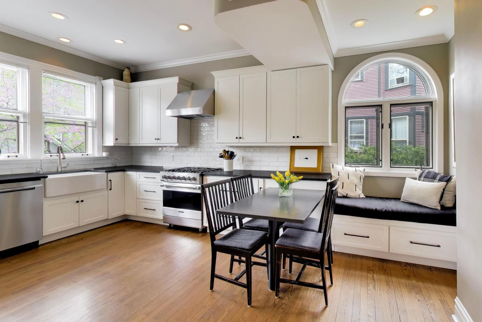 1235 Maple Avenue Evanston, IL 60202 - Photo 19 of 57 a kitchen with a table chairs sink and cabinets