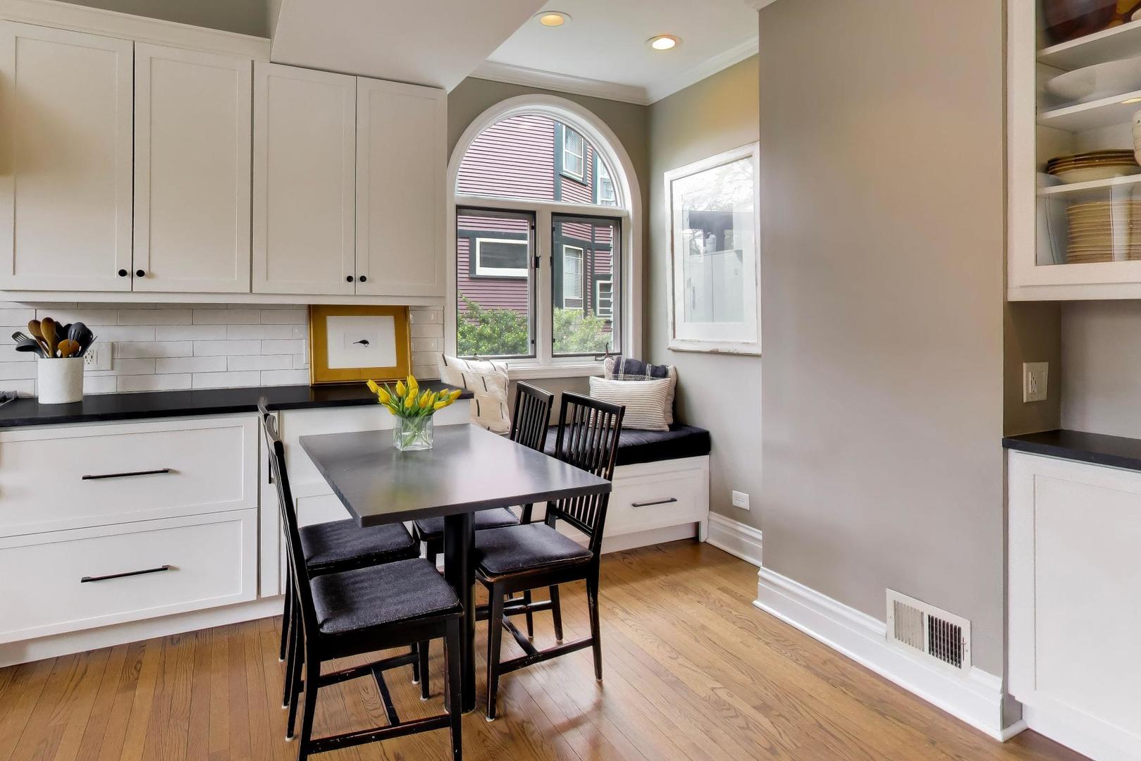 1235 Maple Avenue Evanston, IL 60202 - Photo 22 of 57 a view of a a dining room with furniture window and wooden floor