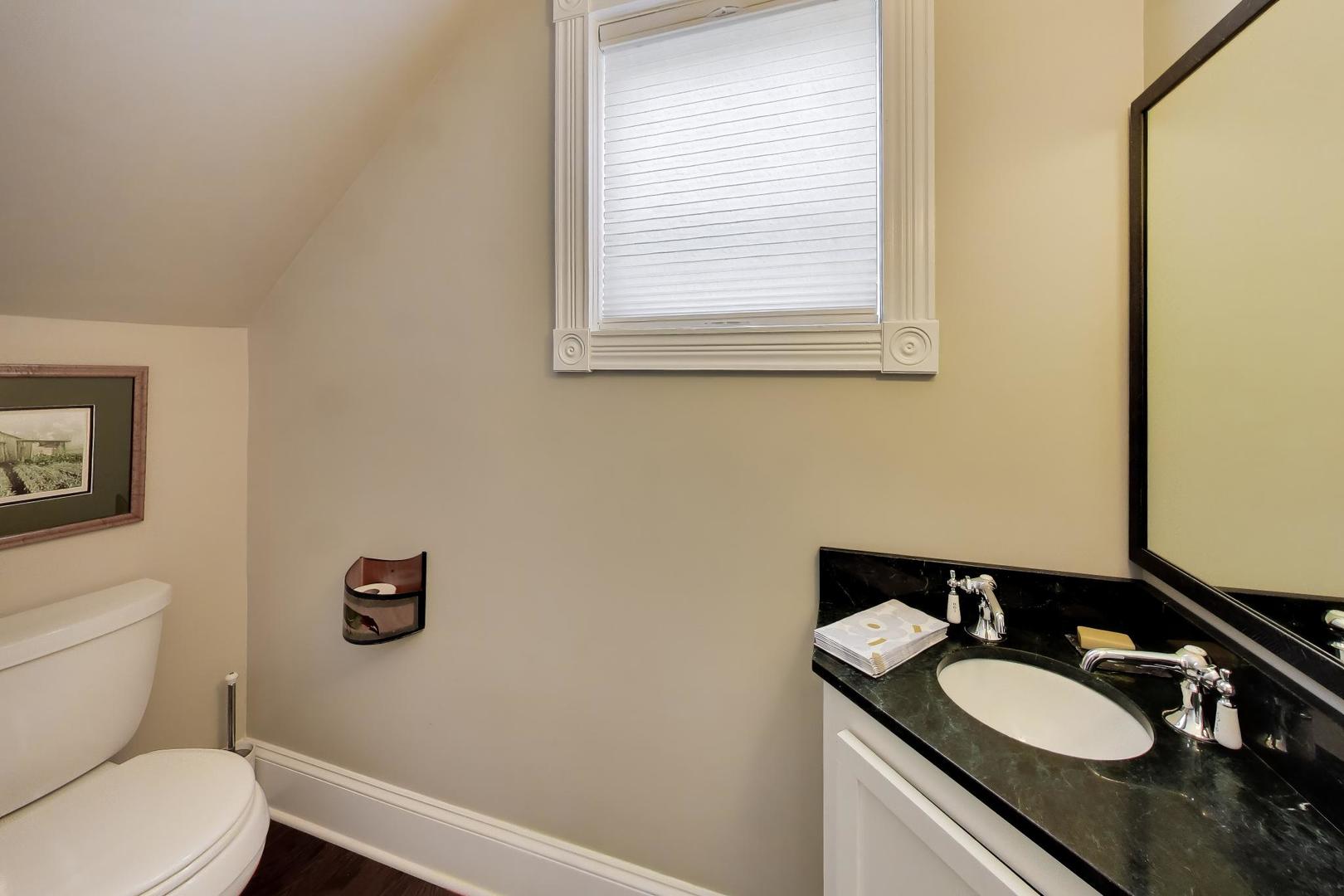 1235 Maple Avenue Evanston, IL 60202 - Photo 25 of 57 a bathroom with a sink a toilet and a mirror