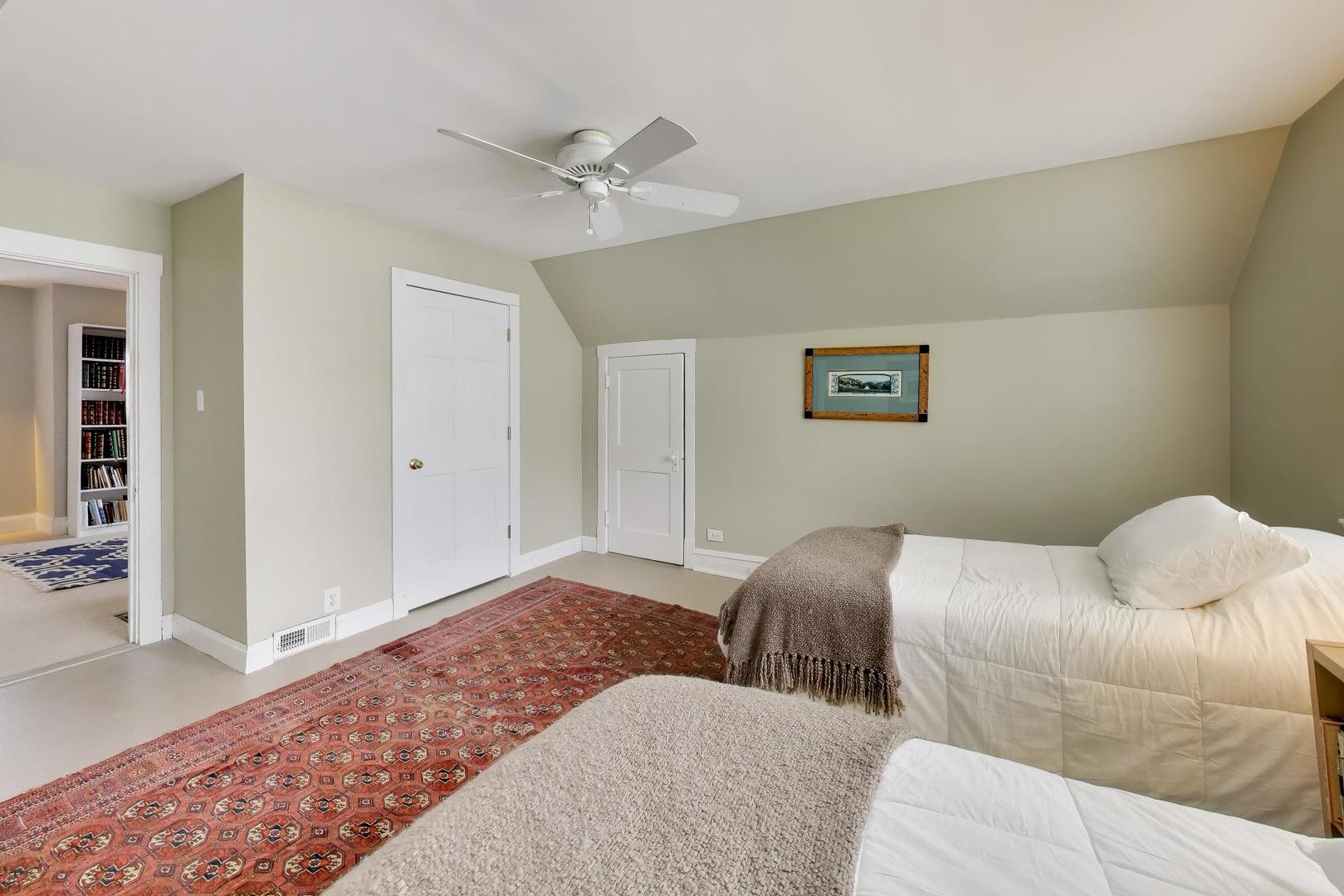 1235 Maple Avenue Evanston, IL 60202 - Photo 37 of 57 a bedroom with a bed and painting on the wall