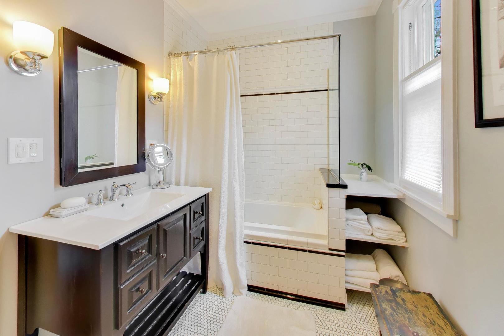 1235 Maple Avenue Evanston, IL 60202 - Photo 38 of 57 a bathroom with a sink and a mirror