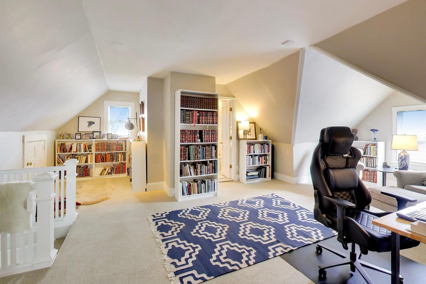 1235 Maple Avenue Evanston, IL 60202 - Photo 40 of 57 a bedroom with furniture and a book shelf