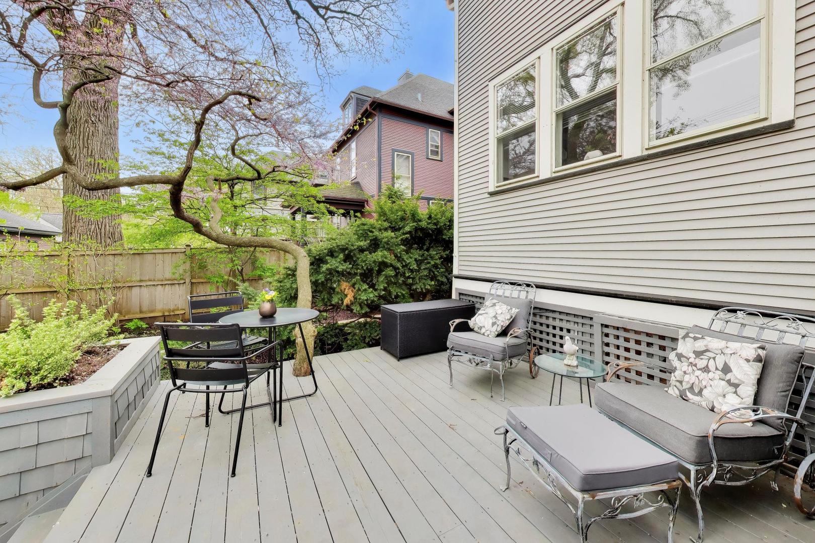 1235 Maple Avenue Evanston, IL 60202 - Photo 46 of 57 a view of a patio with couches table and chairs and potted plants