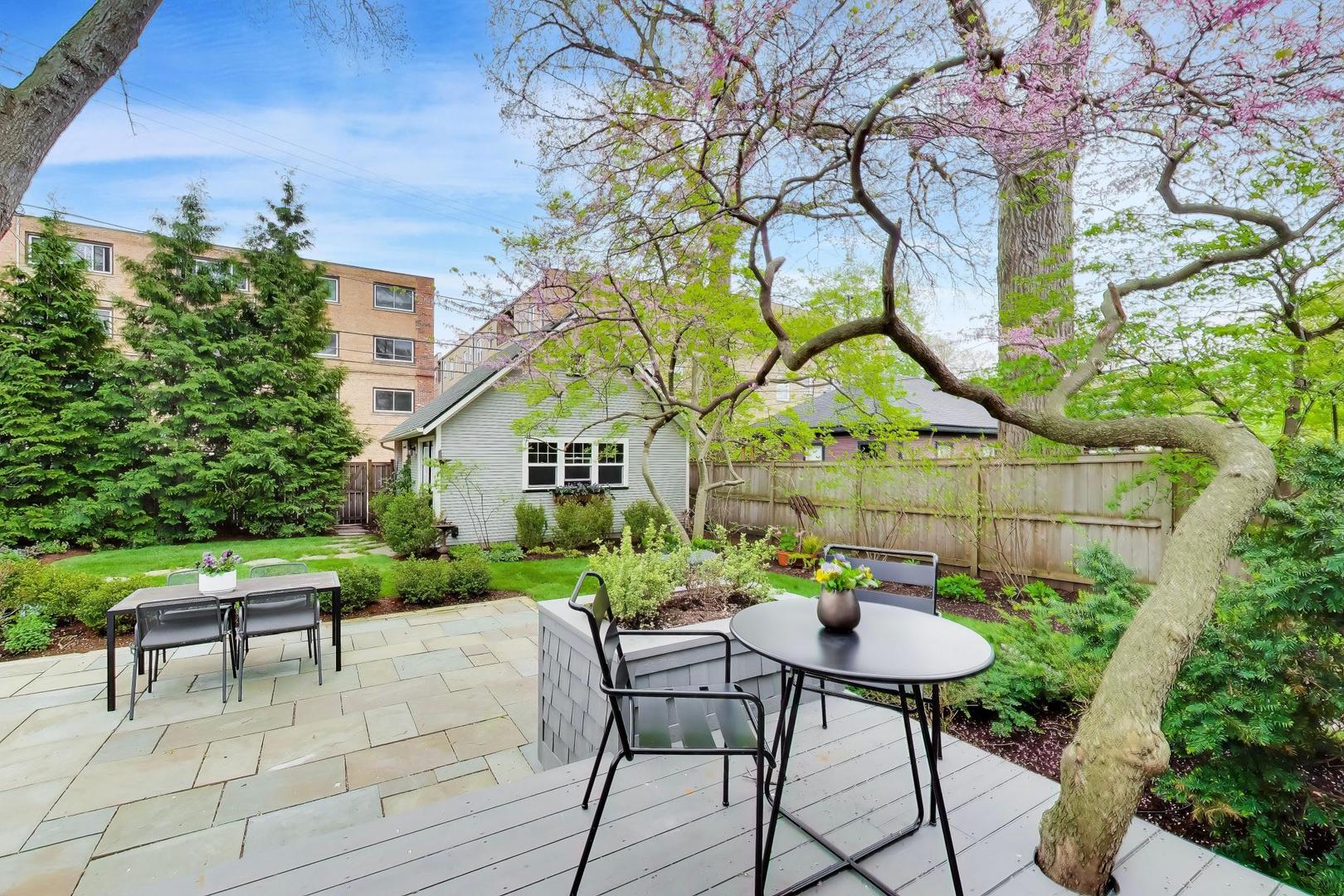 1235 Maple Avenue Evanston, IL 60202 - Photo 48 of 57 a backyard of a house with table and chairs