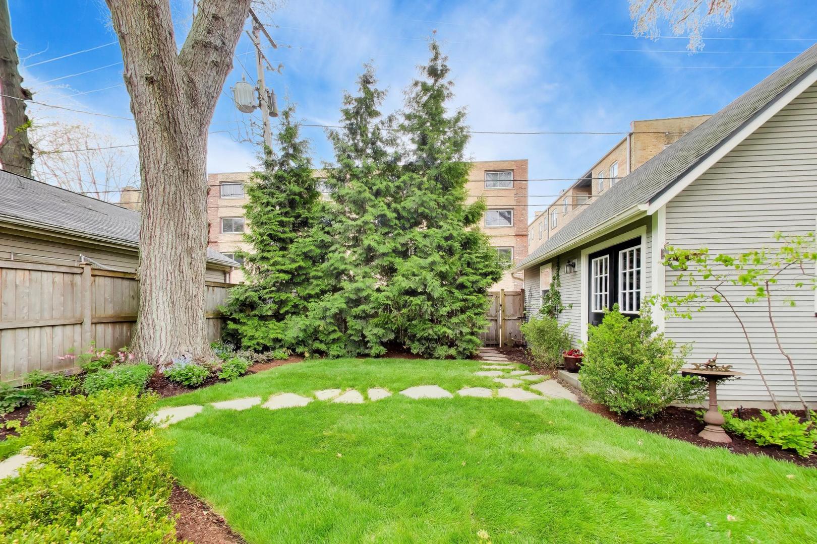 1235 Maple Avenue Evanston, IL 60202 - Photo 51 of 57 a view of a house with a yard and plants