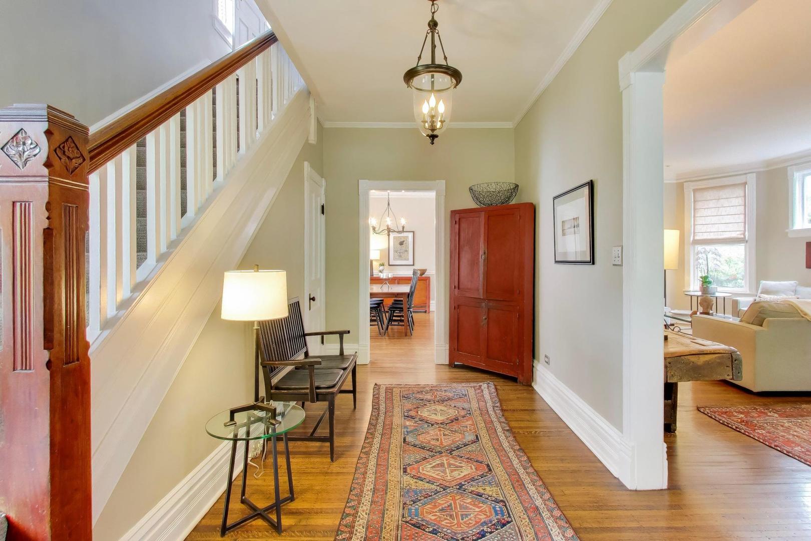 1235 Maple Avenue Evanston, IL 60202 - Photo 6 of 57 a view of a hallway with wooden floor windows and a livingroom