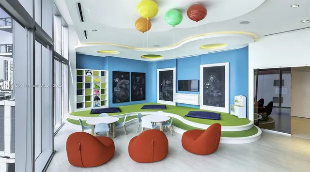 a room with table and chairs