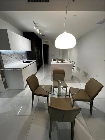 a living room with furniture and a a lamp