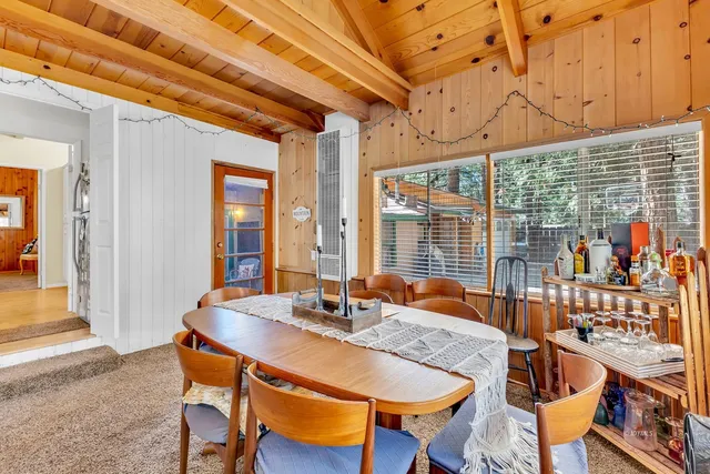 a living room with lots of furniture and a chandelier