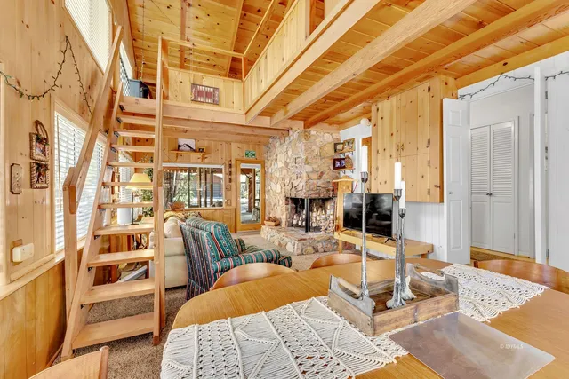 a view of a backyard with sitting area