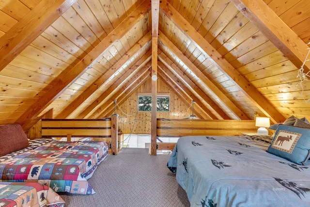 a spacious bathroom with a granite countertop sink and a large window