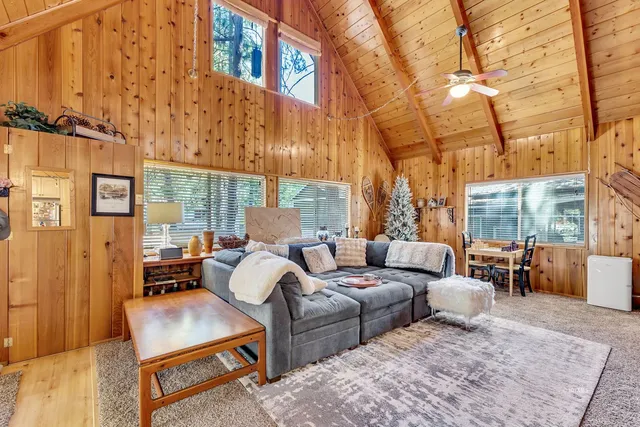 a kitchen with stainless steel appliances kitchen island granite countertop a stove and a wooden cabinets
