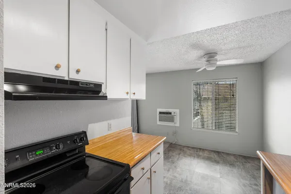 a kitchen with stainless steel appliances a stove and a microwave