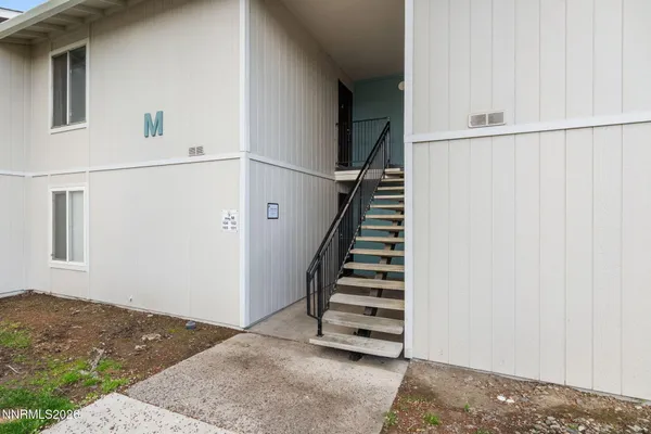 a view of entryway with stairs
