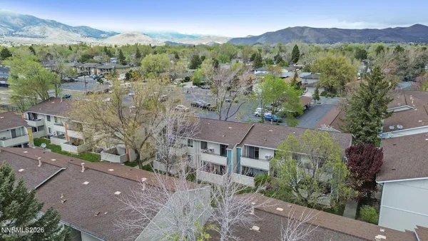 an aerial view of residential houses and outdoor space