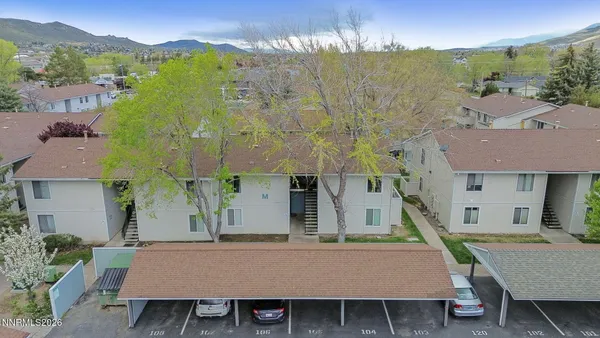 an aerial view of a house with a yard