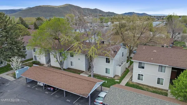 an aerial view of a house with a mountain view