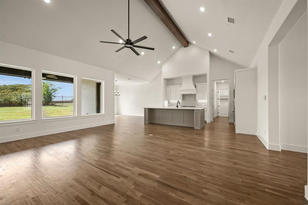 149 Highgate Court Boyd, TX 76023 - Photo 11 of 40 a view of an empty room with wooden floor and a window