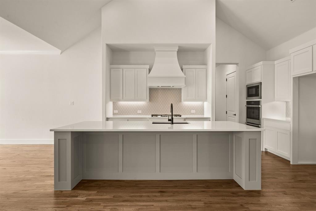 149 Highgate Court Boyd, TX 76023 - Photo 15 of 40 a kitchen with stainless steel appliances a sink and cabinets