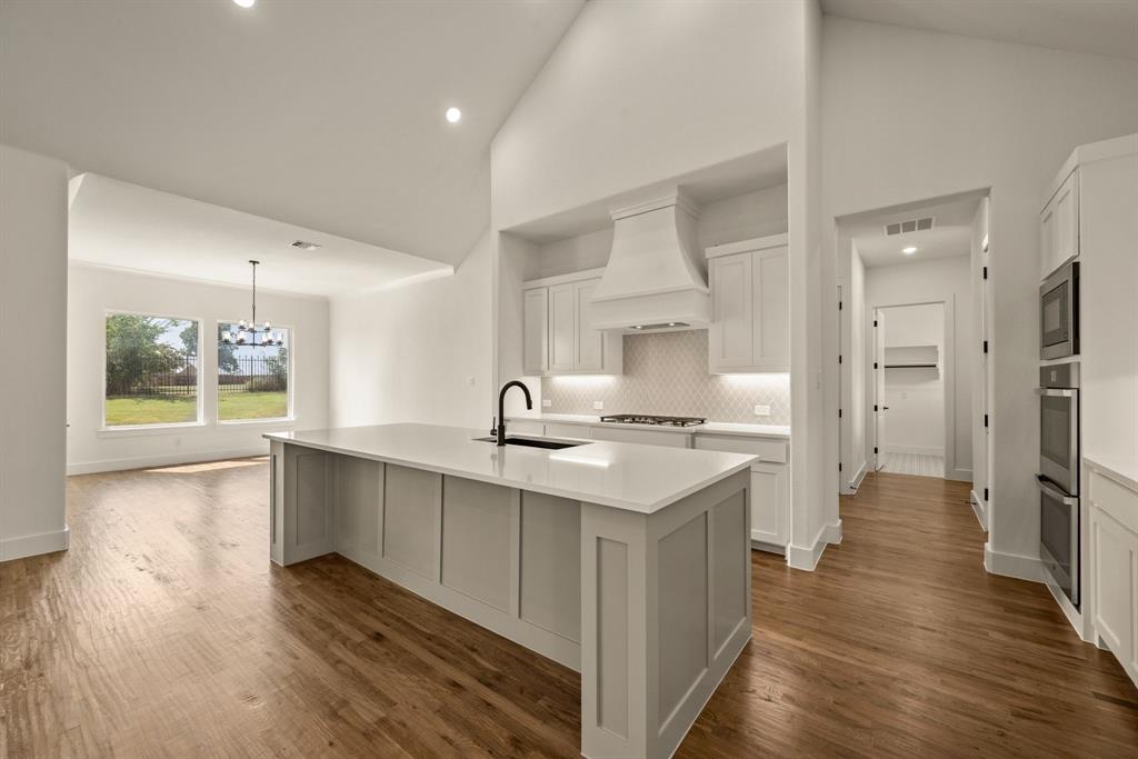 149 Highgate Court Boyd, TX 76023 - Photo 16 of 40 a kitchen with sink stove and refrigerator
