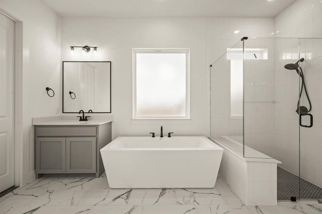 149 Highgate Court Boyd, TX 76023 - Photo 27 of 40 a white bath tub sitting in a bathroom and shower