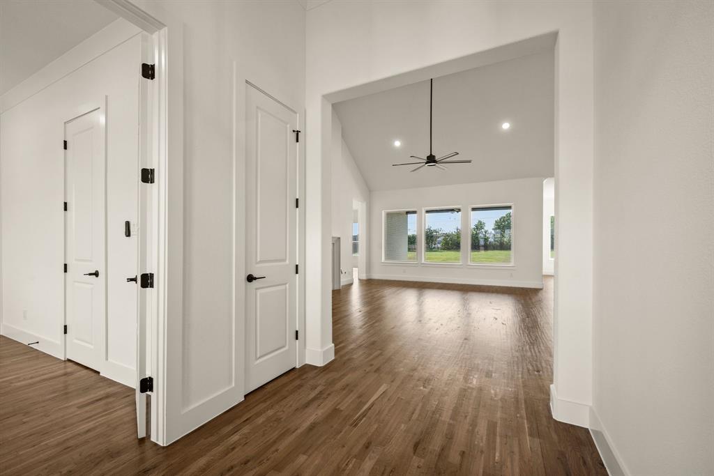 149 Highgate Court Boyd, TX 76023 - Photo 8 of 40 wooden floor in an empty room with a window