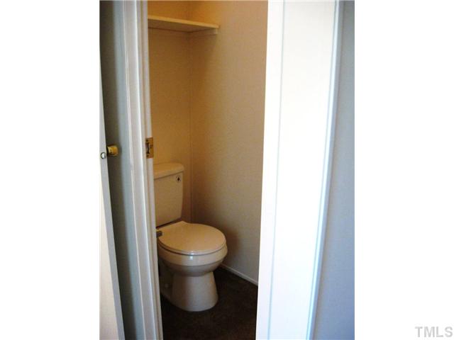 246 Skeet Range Road Coats, NC 27521 - Photo 12 of 20 a bathroom with a toilet