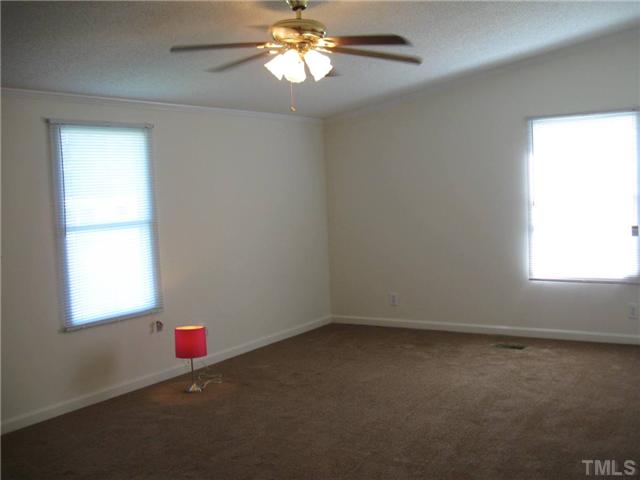 246 Skeet Range Road Coats, NC 27521 - Photo 13 of 20 an empty room with a window