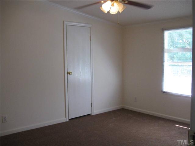 246 Skeet Range Road Coats, NC 27521 - Photo 15 of 20 an empty room with a window