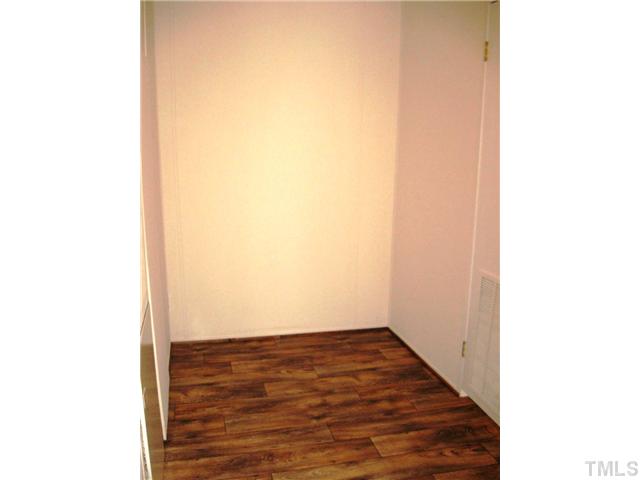 246 Skeet Range Road Coats, NC 27521 - Photo 18 of 20 a view of a room with wooden floor