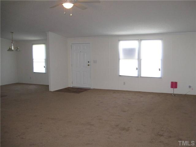 246 Skeet Range Road Coats, NC 27521 - Photo 3 of 20 an empty room with a window