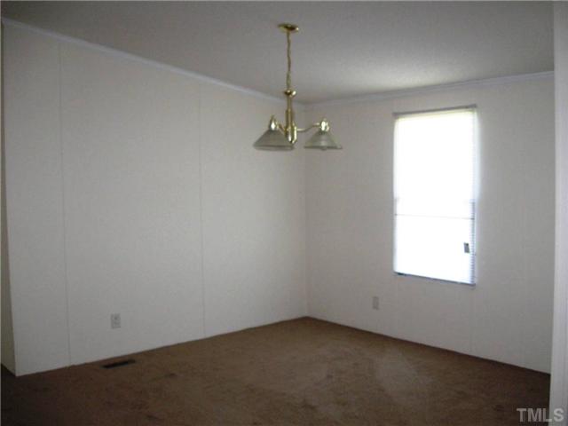 246 Skeet Range Road Coats, NC 27521 - Photo 4 of 20 an empty room with a window