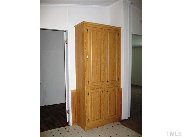 246 Skeet Range Road Coats, NC 27521 - Photo 7 of 20 a view of cabinet with front door