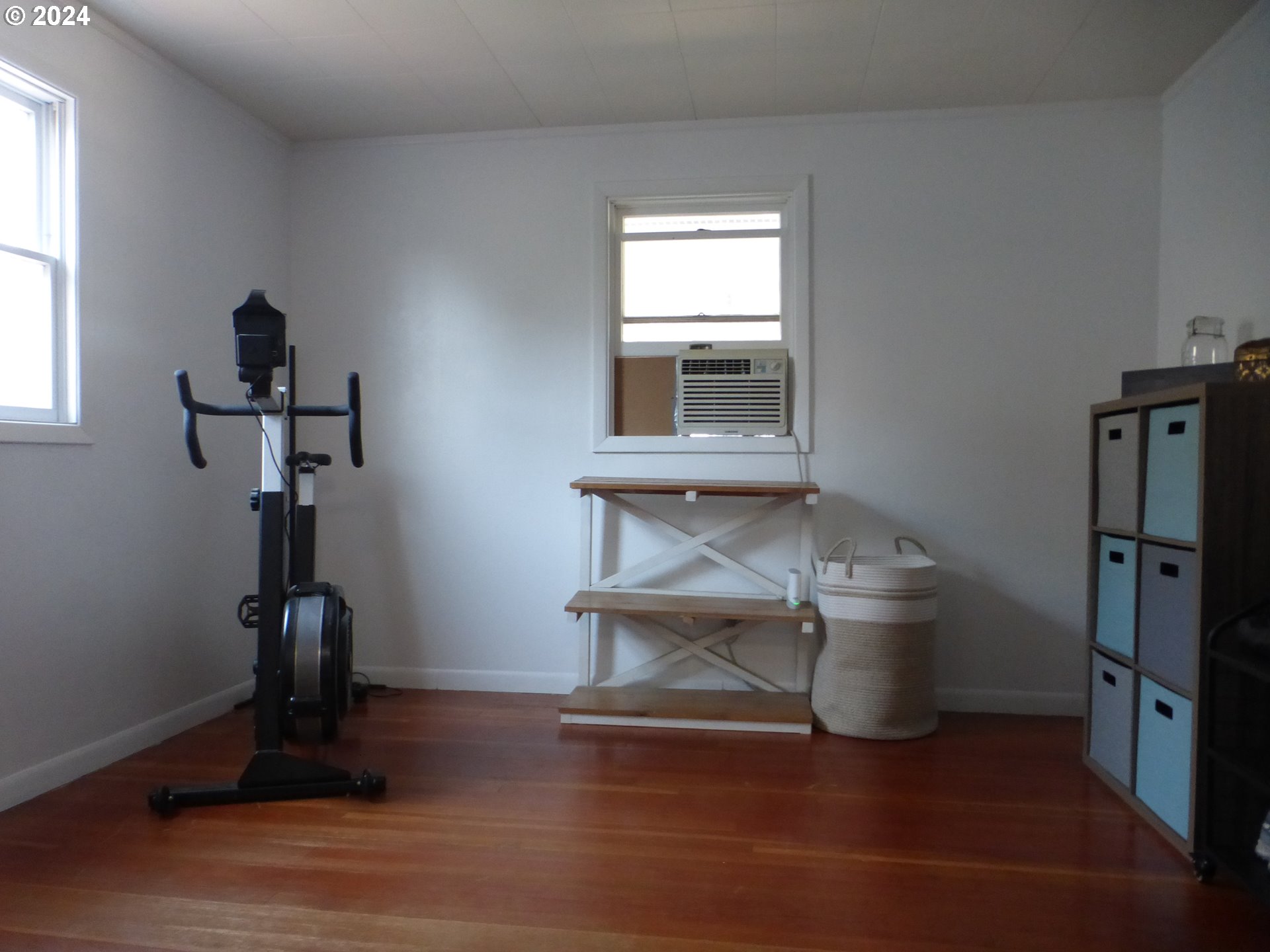 1026 M Street Springfield, OR 97477 - Photo 16 of 20 a view of hallway with window and wooden floor