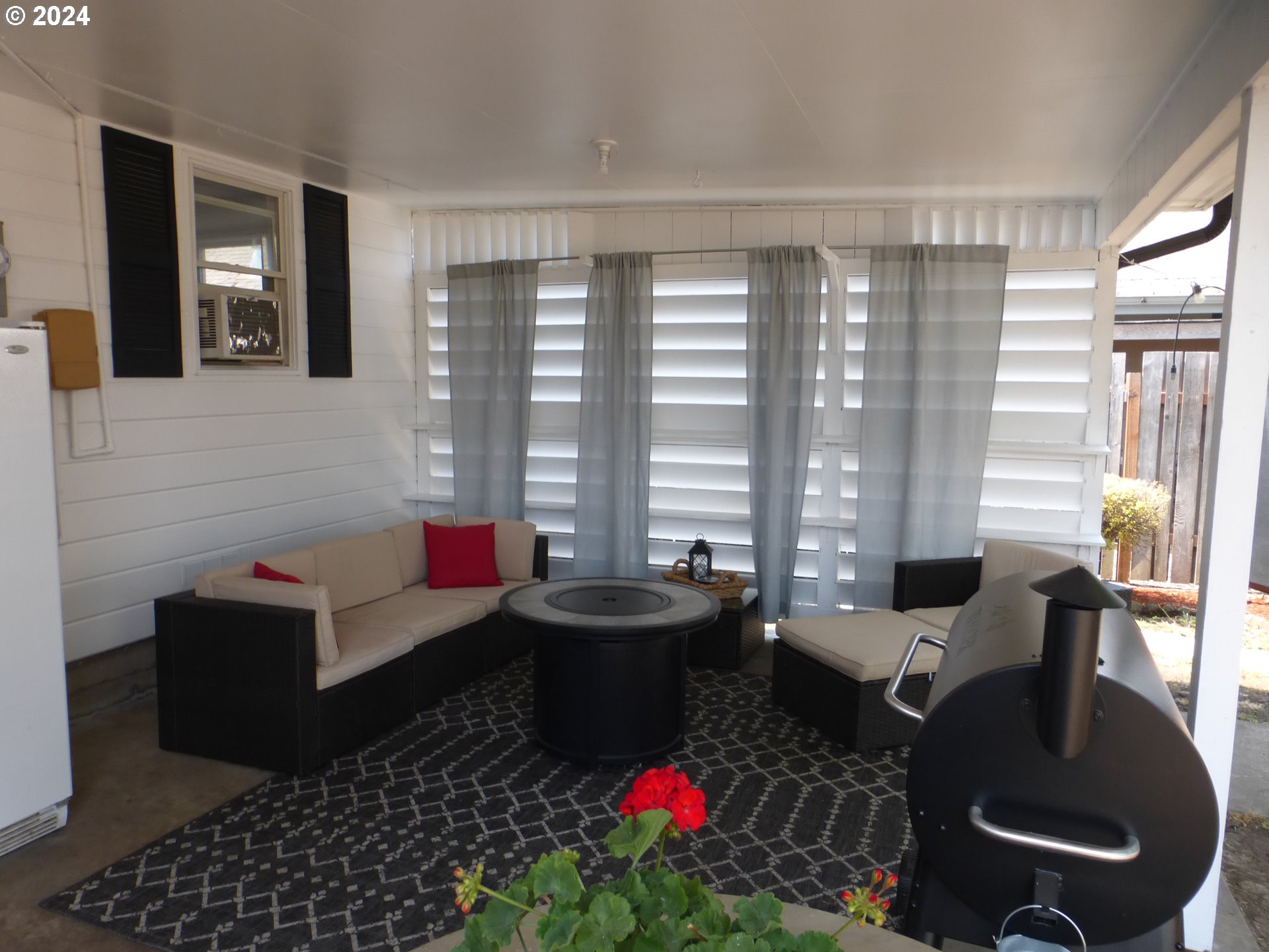 1026 M Street Springfield, OR 97477 - Photo 2 of 20 a living room with furniture and a floor to ceiling window