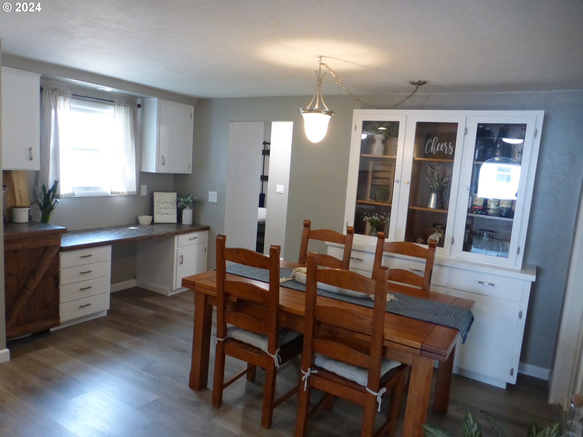 1026 M Street Springfield, OR 97477 - Photo 3 of 20 a view of a dining room with furniture and wooden floor