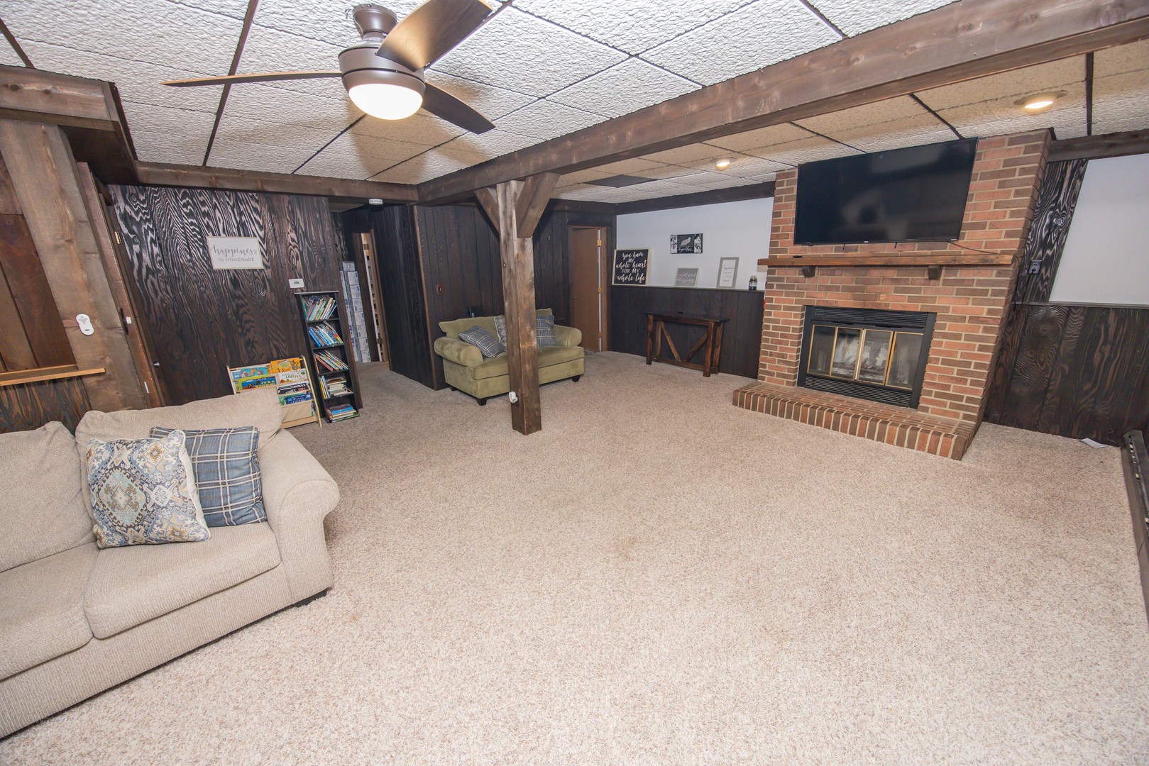 613 Westnedge Road Joliet, IL 60435 - Photo 18 of 33 a living room with furniture and a flat screen tv