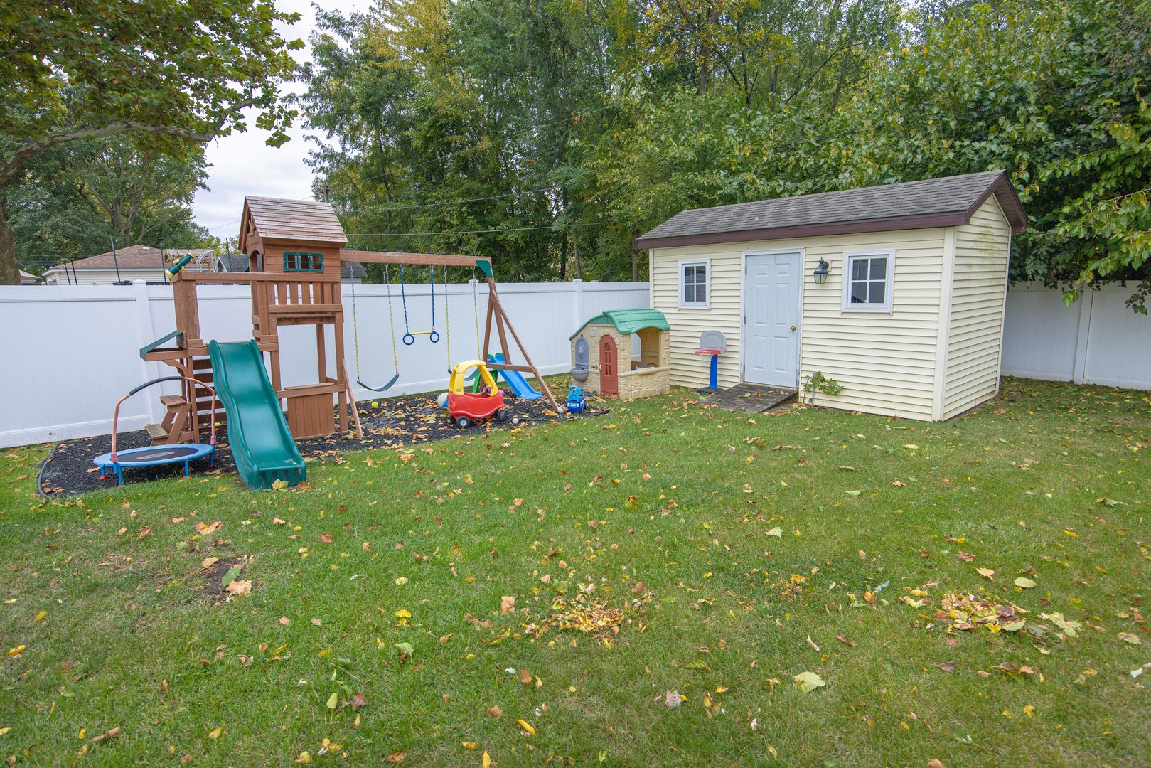 613 Westnedge Road Joliet, IL 60435 - Photo 30 of 33 a view of a backyard with a small cabin and chair