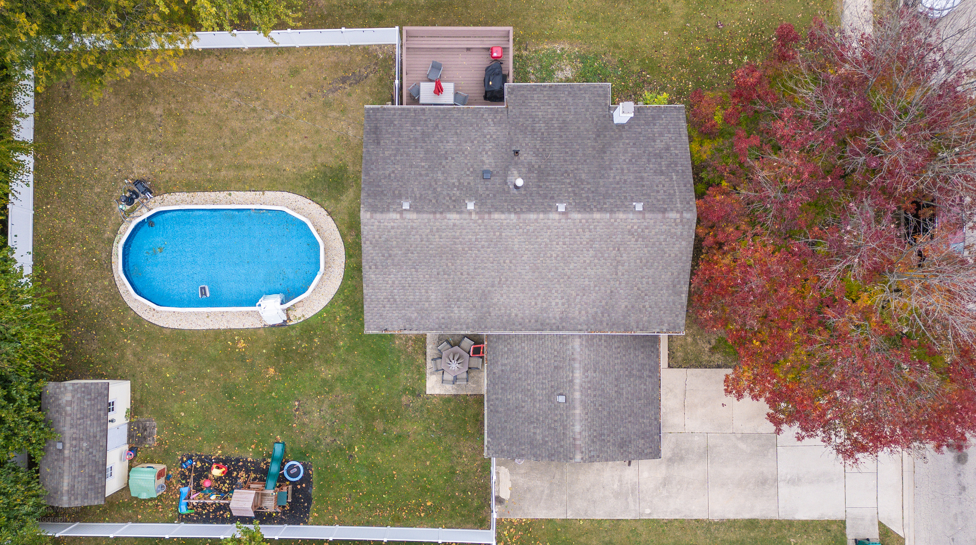 613 Westnedge Road Joliet, IL 60435 - Photo 31 of 33 an aerial view of a house with a swimming pool and large trees