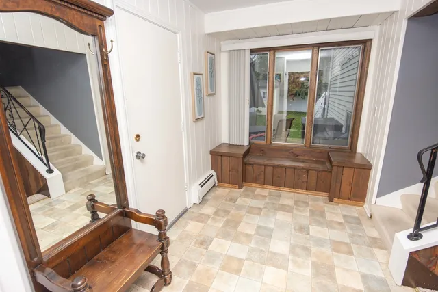 a living room with a couch next to a window