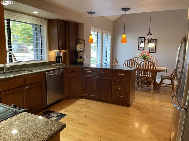 a kitchen with sink and window