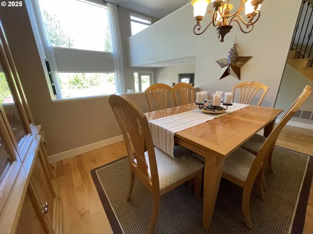 a view of a dining room with furniture window and outside view