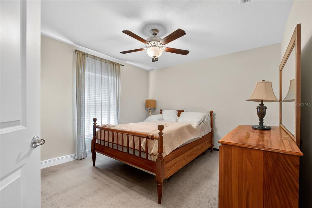 2429 Twin Lake View Road Winter Haven, FL 33881 - Photo 31 of 37 a bed sitting in a bedroom next to a window