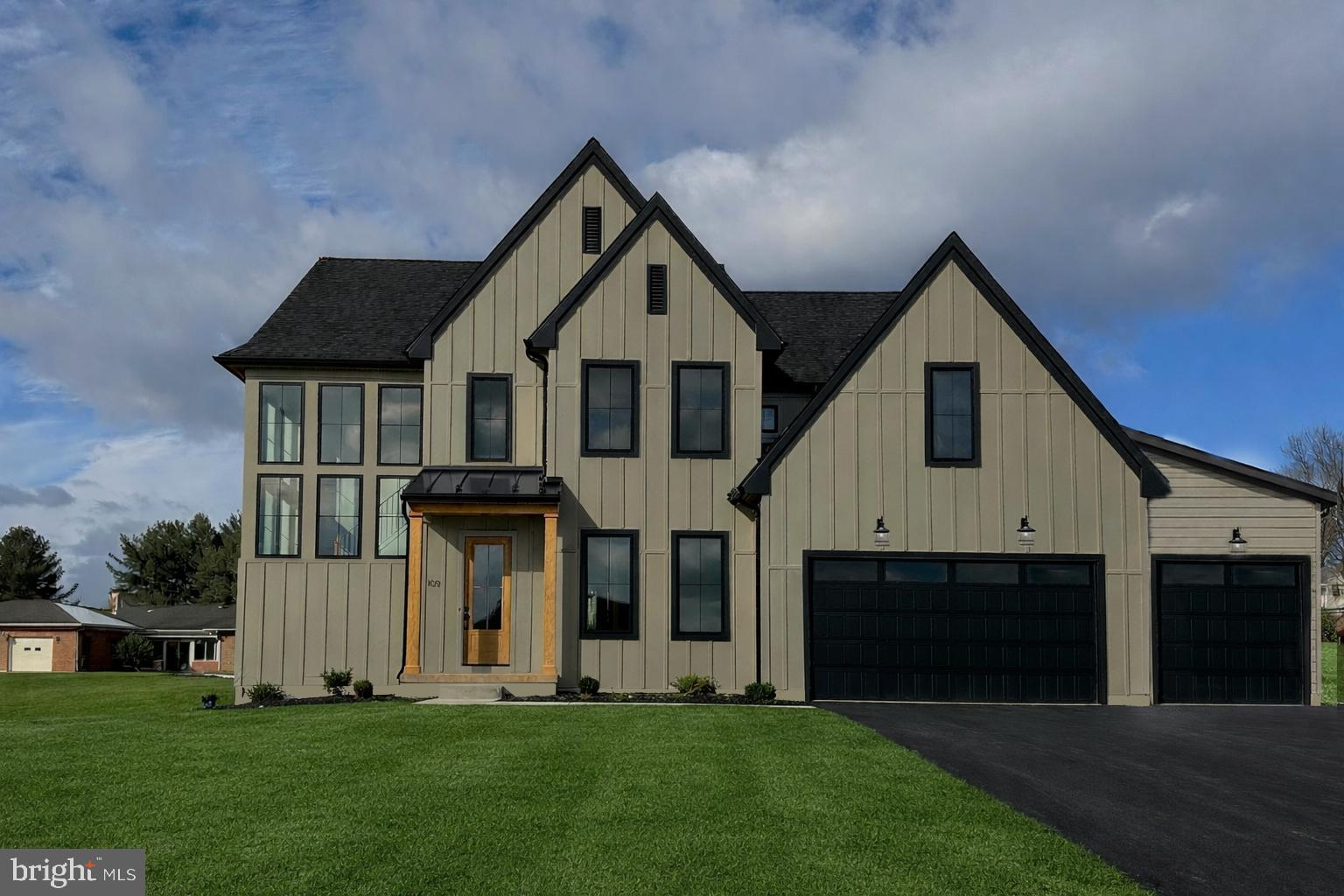 a front view of a house with a yard
