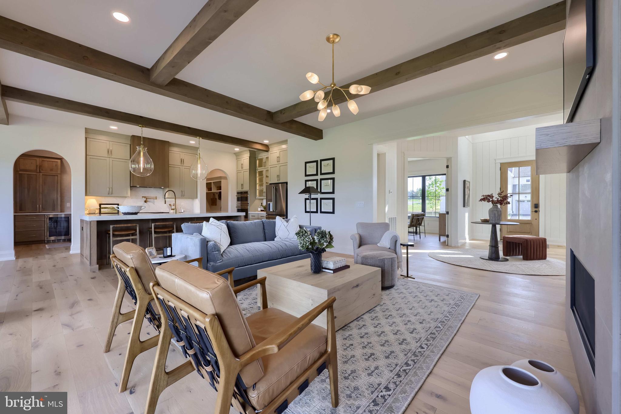 3 Balsam Lane Lititz, PA 17543 - Photo 13 of 52 a living room with fireplace furniture and a chandelier