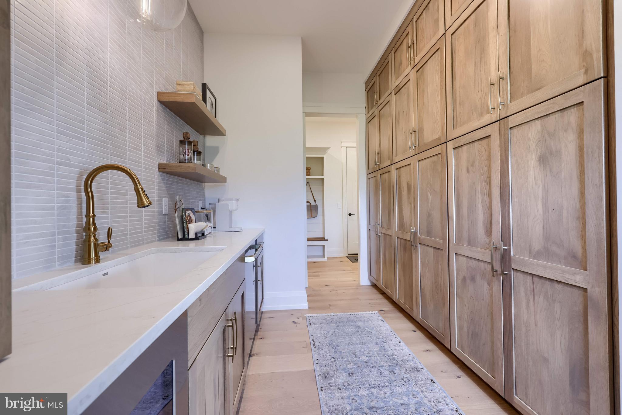 3 Balsam Lane Lititz, PA 17543 - Photo 27 of 52 a kitchen with sink a refrigerator and cabinets