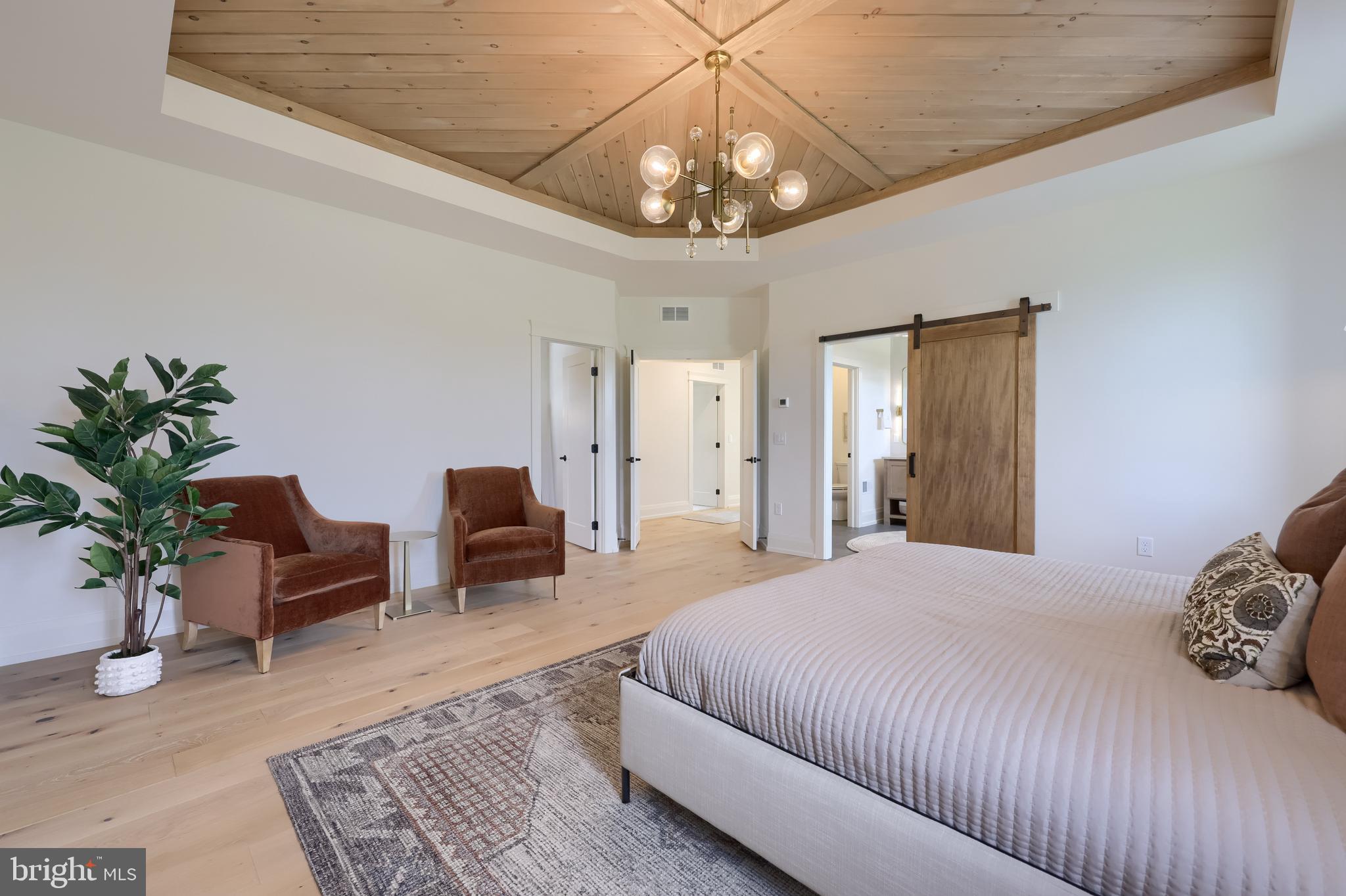 3 Balsam Lane Lititz, PA 17543 - Photo 44 of 52 a bedroom with a large bed and a chandelier