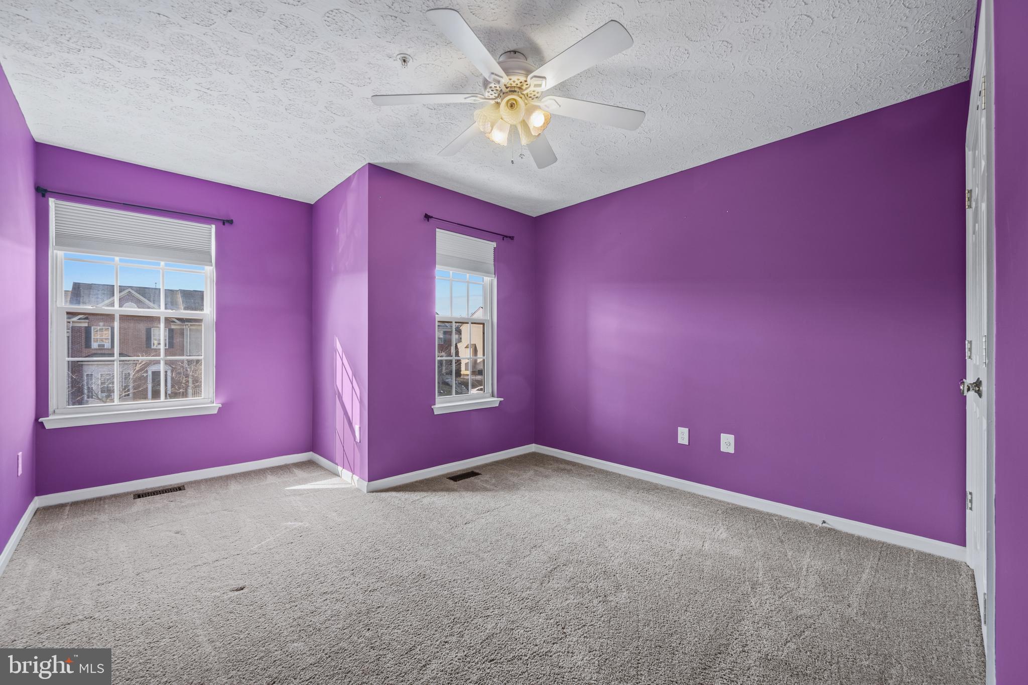 2961 Raking Leaf Drive Abingdon, MD 21009 - Photo 15 of 28 a empty room with windows and chandelier fan