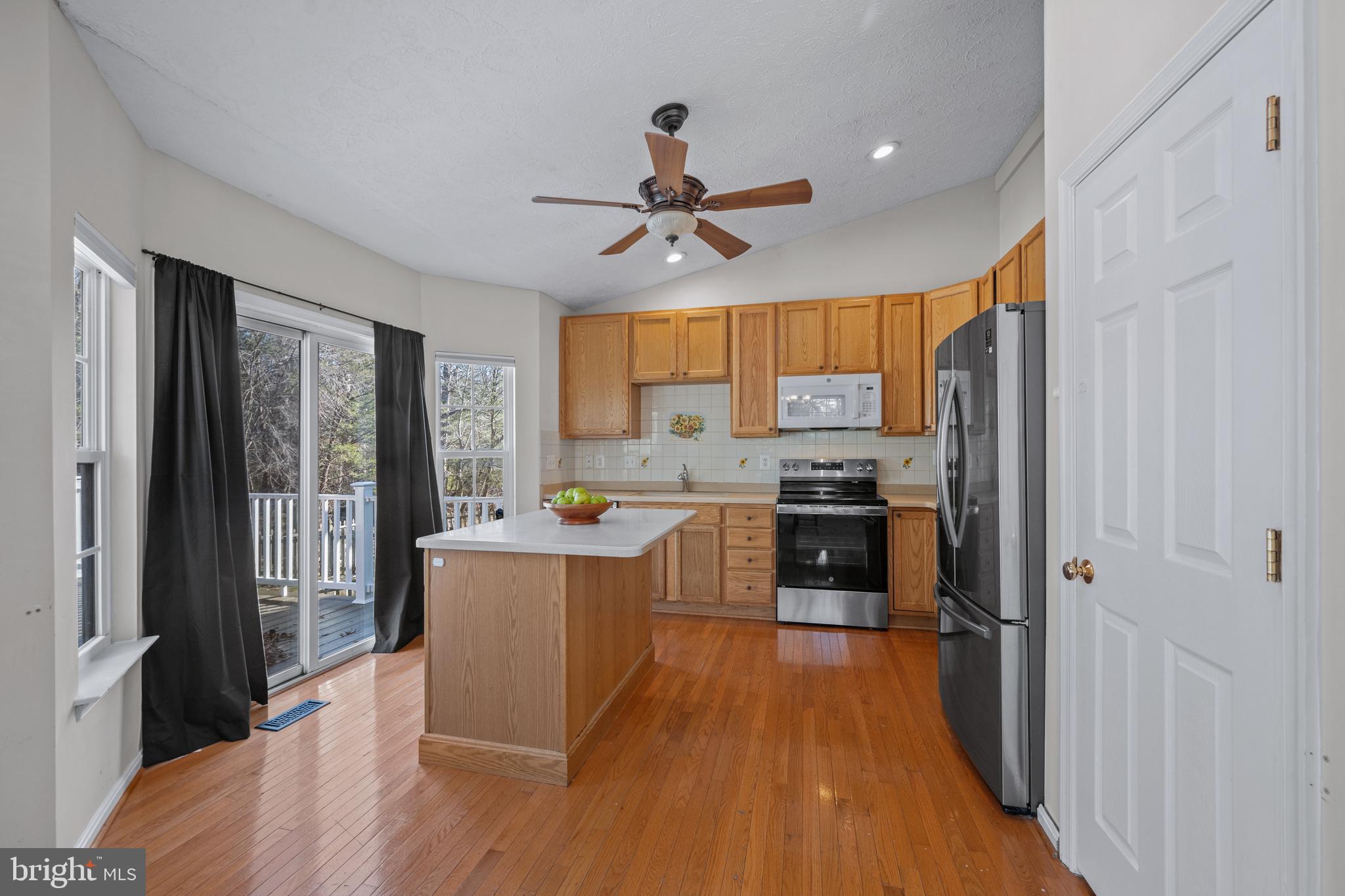 2961 Raking Leaf Drive Abingdon, MD 21009 - Photo 10 of 28 a kitchen with stainless steel appliances a stove top oven a refrigerator a sink and a cabinets